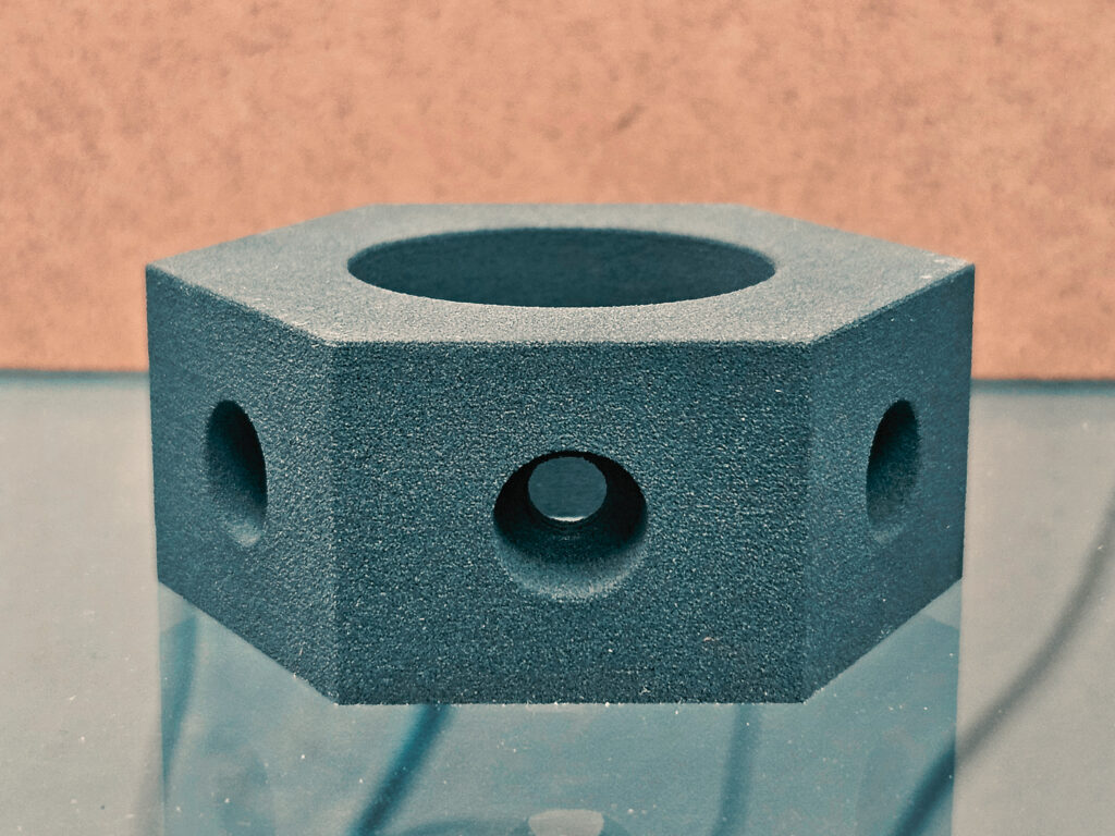 an SLS 3D printed nylon hexagon.